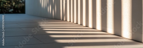 A stunning play of shadows against a pristine wall, reflecting modern architectural design, invoking a sense of depth and texture in minimalist aesthetics and artistic expression.