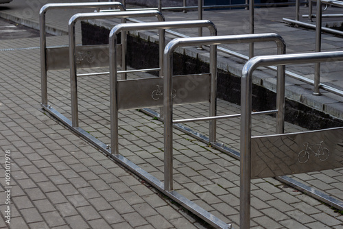 Bicycle parking in the city. Metal structure for parking in chrome color