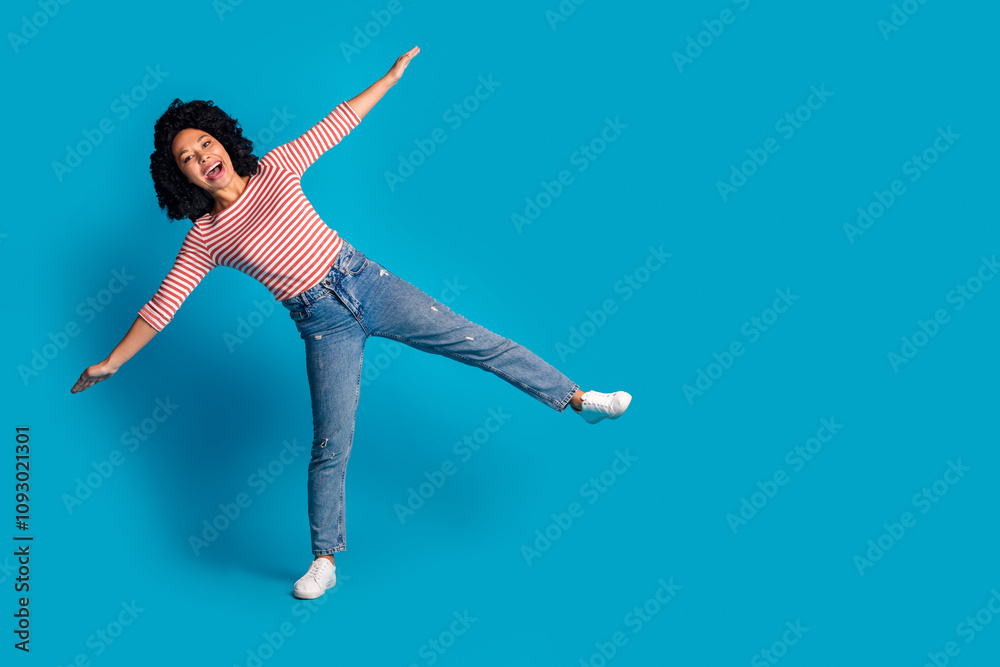 Obraz premium Photo of crazy funky cheerful girl wear trendy clothes going string empty space isolated on blue color background