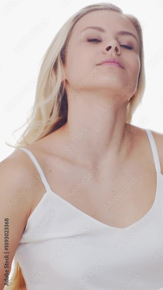 Young woman stretching in bed, framed by sunlight streaming through large curtains, evokes a sense of morning calm and rejuvenation. Young woman stretching in bed, framed by sunlight streaming through large curtains, evokes a sense of morning calm and rejuvenation.