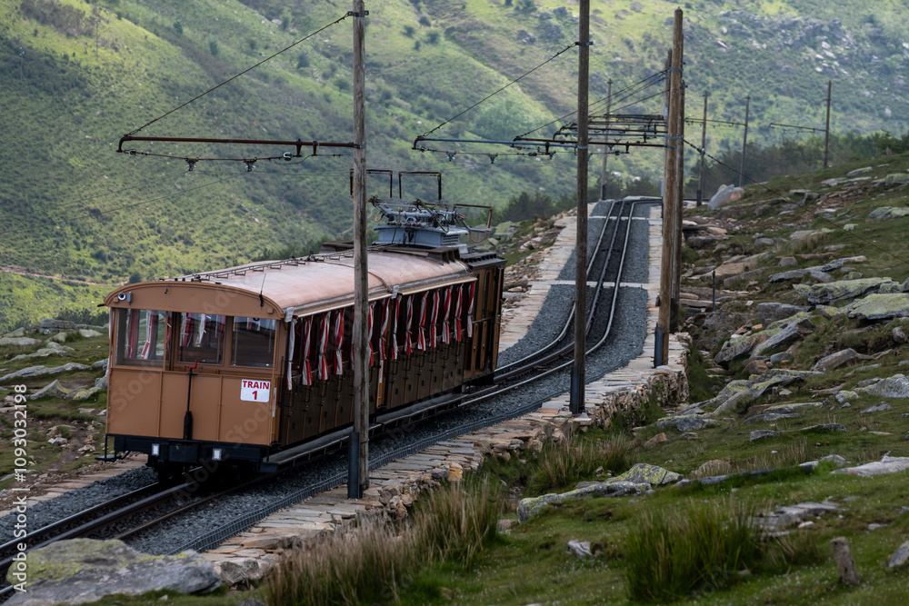 Travelling by old wooden train up to Larrun or La Rhune, Larhune mountain at the western end of the Pyrenees located on border of France and Spain, in traditional Basque provinces Labourd and Navarra Travelling by old wooden train up to Larrun or La Rhune, Larhune mountain at the western end of the Pyrenees located on border of France and Spain, in traditional Basque provinces Labourd and Navarra