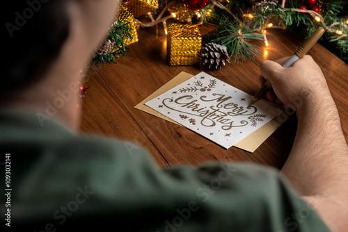 Writing a Merry Christmas Card with Festive Decorations