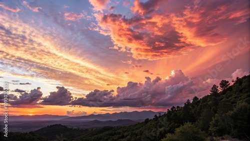 Warm hues and fluffy white clouds create a stunning sunset effect, natural beauty, cloud formations, fluffy white clouds