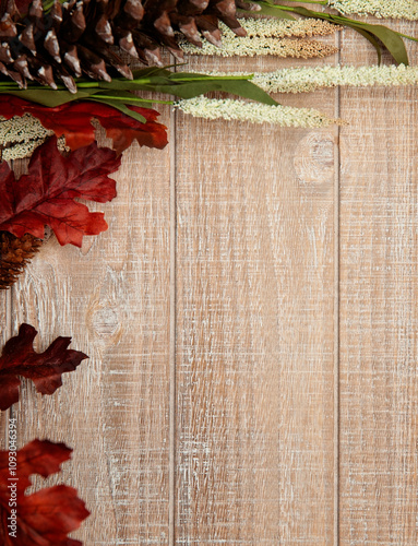 Fall flatlay with leaves and wheat on wooden background. Edit with text.  photo