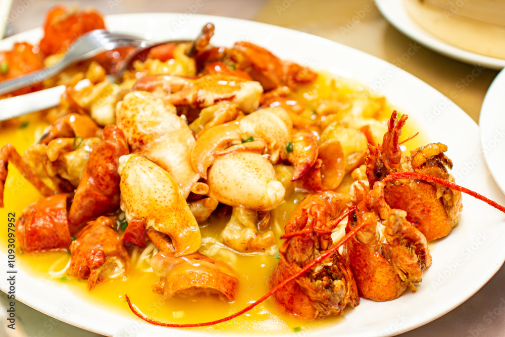 a plate of shrimp with a yellow sauce on it a plate of shrimp with a yellow sauce on it