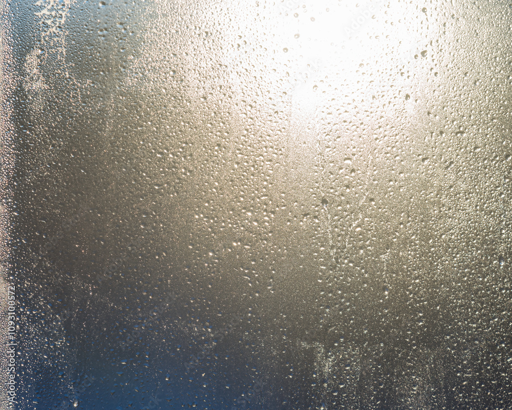 A pattern of frozen drops on the window opposite the sun A pattern of frozen drops on the window opposite the sun