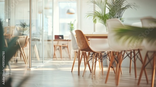Modern Minimalist Office Space with Natural Light and Plants  Featuring Stylish Furniture and Open Layout  Ideal for Creative Collaboration and Productivity Enhancement