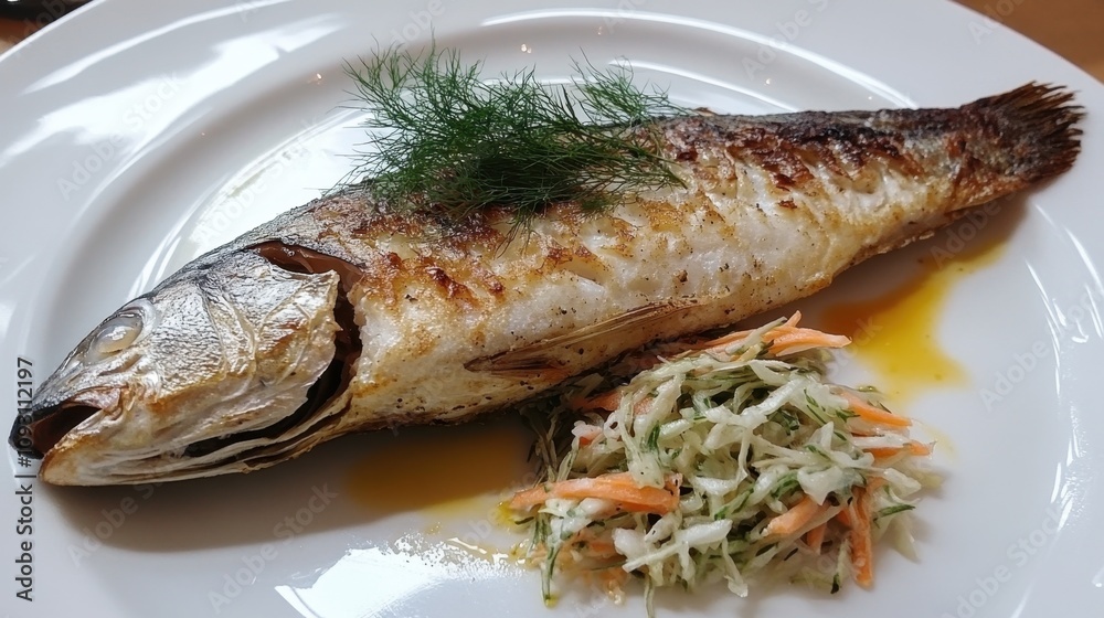 Grilled fish dish with fresh herbs and coleslaw garnish on a white plate for gourmet presentation Grilled fish dish with fresh herbs and coleslaw garnish on a white plate for gourmet presentation