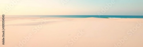 Softly fading light on a pristine white sandy beach with an endless blue horizon, scenic, ocean, soothing