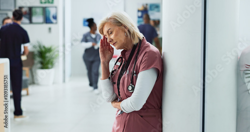 Surgeon, headache and woman with stress, tired and fatigue with mental health challenge in hospital. Nurse, migraine and mature medical professional with depression, burnout and sick or exhausted