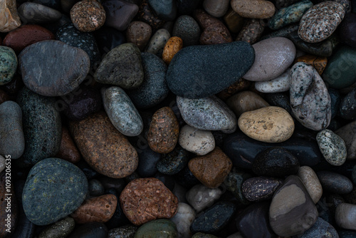 Wet pebbles on the sea shore photo