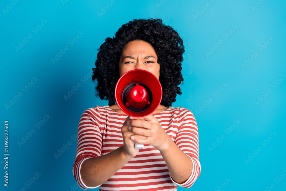 Obraz premium Photo of crazy charming girl wear stylish striped clothes hold bullhorn announce news isolated on blue color background
