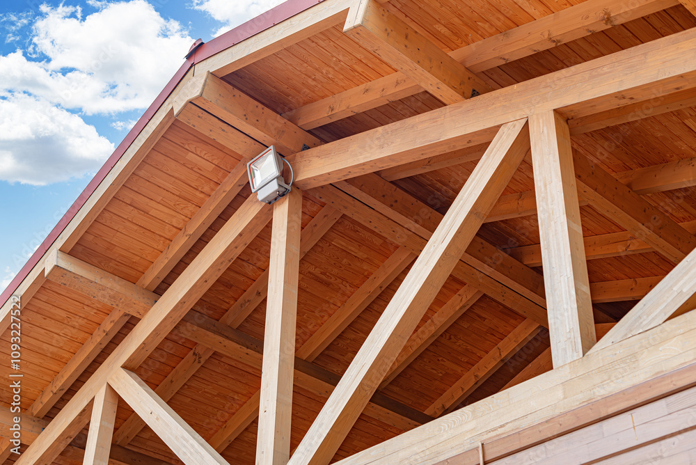 Construction of a wooden roof of a frame house.