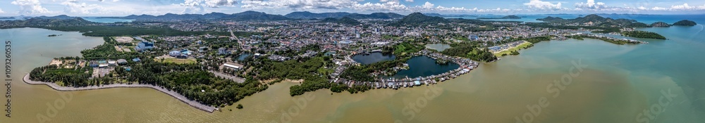 Obraz premium 180° panoramic aerial view of Phuket Town, from Saphan Hin Park across downtown to Cape Tukkae with mountain landscape in background, located on Phuket Island, Thailand