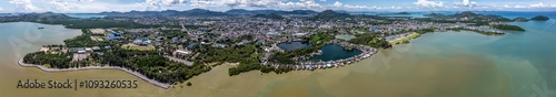 180° panoramic aerial view of Phuket Town, from Saphan Hin Park across downtown to Cape Tukkae with mountain landscape in background, located on Phuket Island, Thailand