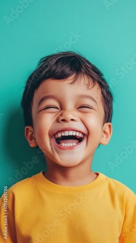 Joyful Child with Bright Smile Posing Against Colorful Background in Yellow Shirt, Radiating Happiness and Playfulness, Perfect for Family or Children Related Projects