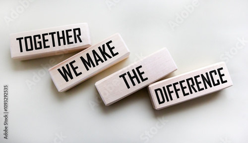 Together we will change the text on the wooden blocks on a white background photo