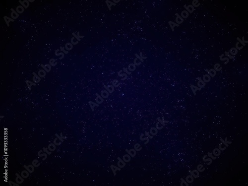 Dark indigo background with numerous tiny stars and a hint of starlight, tiny, night, atmosphere