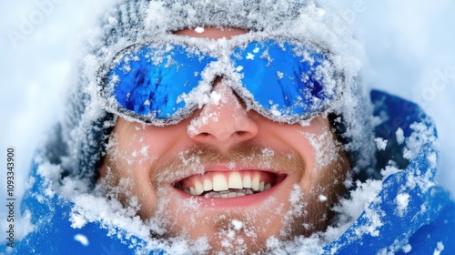 Winter smile, close-up of skier’s face covered with snowflakes