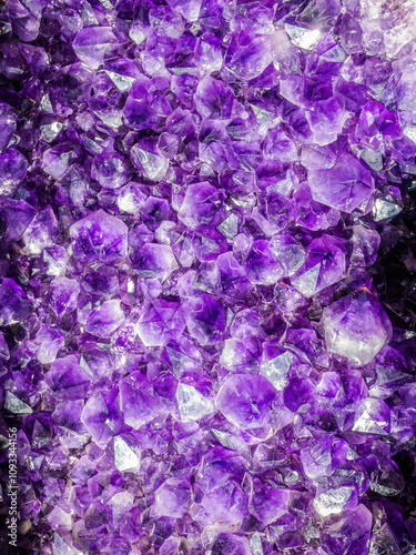 Amethyst purple crystals. Mineral crystals in geode. Gemstones amethyst bright lilac, texture of stone