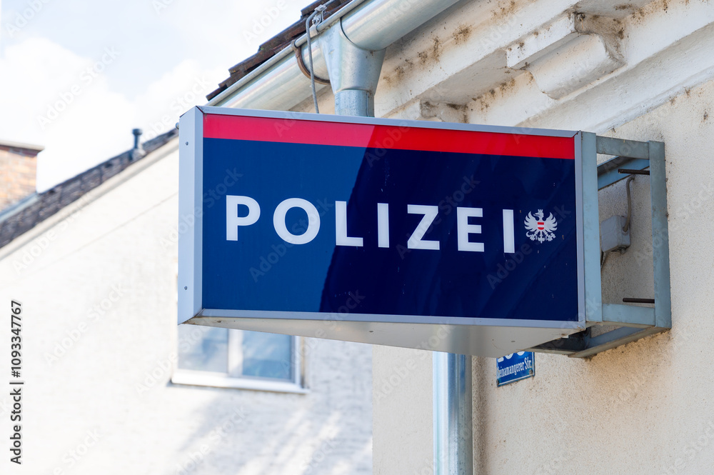 Polizei, police sign on wall. Police department in Austria. Crimes and safety.