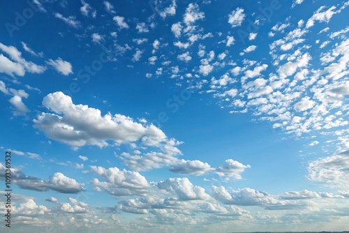 A clear blue sky with scattered white altocumulus clouds that create a beautiful gradient effect, white cloud, gradient effect, altocumulus cloud