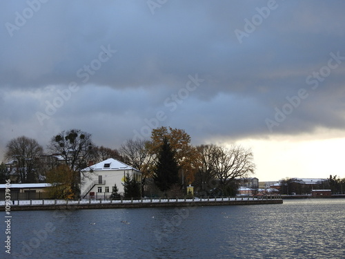 upper lake in kaliningrad, russia, with heavy winter clouds photo