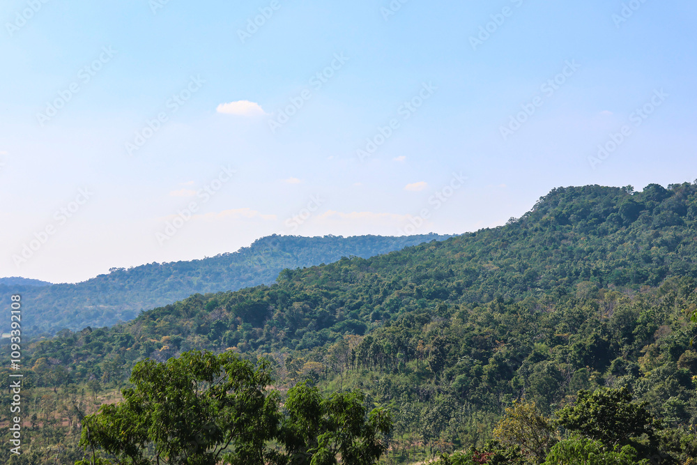 Two green mountains and a clear sky Two green mountains and a clear sky