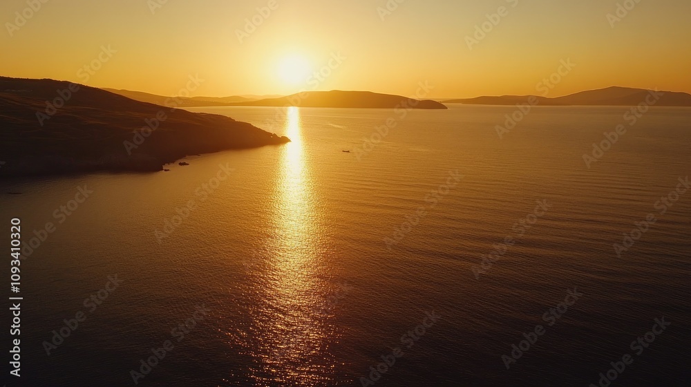 Serene Golden Sunset Reflecting on Calm Ocean Waters with Silhouetted Hills in the Background Serene Golden Sunset Reflecting on Calm Ocean Waters with Silhouetted Hills in the Background