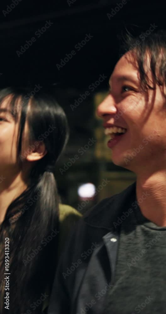 Night, travel and couple sightseeing with smile, romance and outdoor holiday adventure in Japanese city. Love, happy man and woman walking on urban date together with pointing, wow and vacation trip Night, travel and couple sightseeing with smile, romance and outdoor holiday adventure in Japanese city. Love, happy man and woman walking on urban date together with pointing, wow and vacation trip