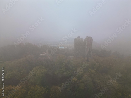 medieval fantasy tower with modern hotels in the background - aerial drone photo, serbia, vrdnik, fruska mountain photo