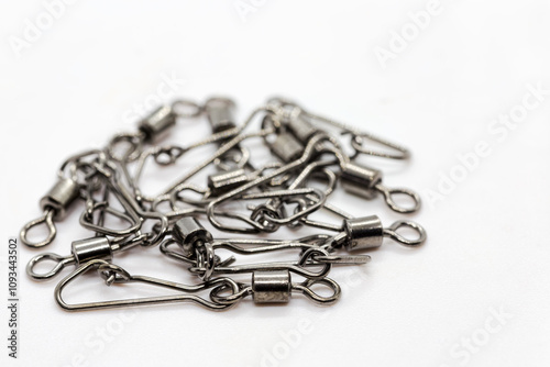 Fishing accessories, chromed swivels with snap hooks useful to connects terminals, beams and other accessories to the main fishing line