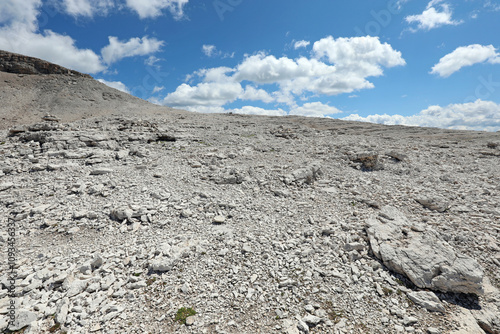 Almost lunar landscape with stones and rocks in the Italian Alps during summer on Mount Pordoi nearly 3000 meters photo