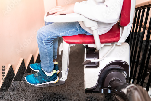 Close-Up of Child's Legs on Stairlift