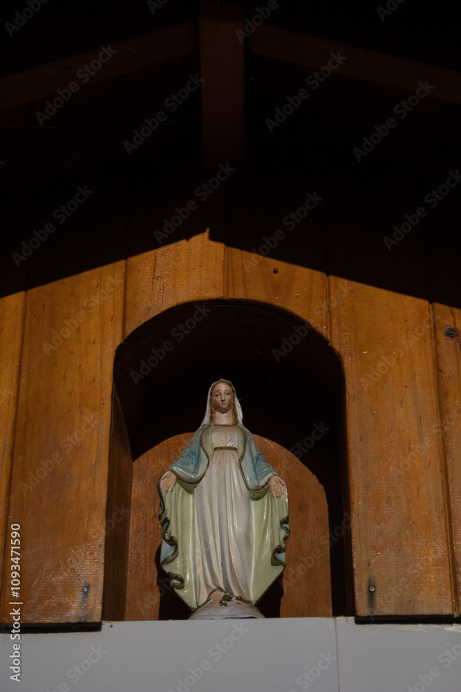Statue of the Virgin Mary in a wooden house Statue of the Virgin Mary in a wooden house