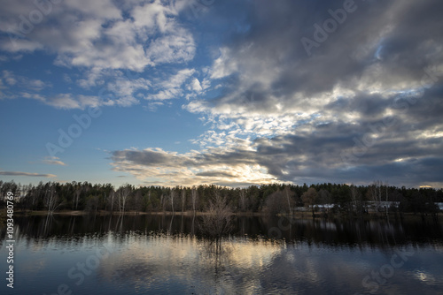 Calm lake with a cloudy sky in the background