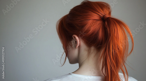 Fiery crimson red high ponytail with a messy textured look vibrant and energetic hairstyle