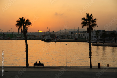 Fototapeta Naklejka Na Ścianę i Meble -  ALICANTE, SPAIN - NOVEMBER 5, 2024 : Beautiful sunset at the port in Alicante