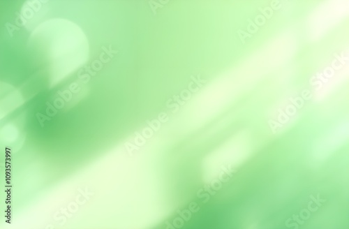 Abstract green background with sunny rays and bokeh.