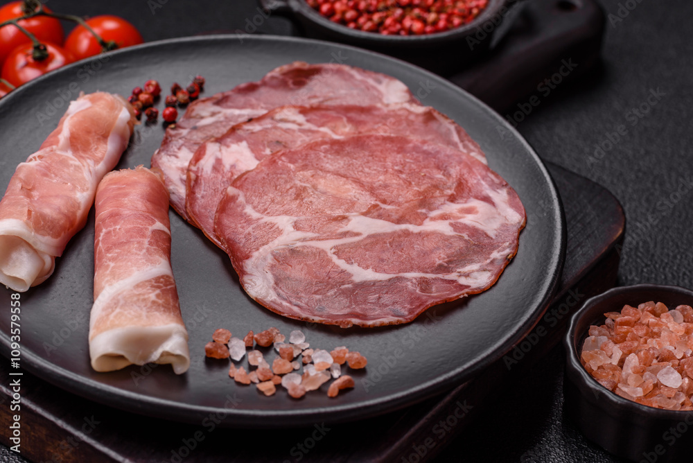 Antipasto jamon, prosciutto, sausage, sliced with tomatoes, salt and spices Antipasto jamon, prosciutto, sausage, sliced with tomatoes, salt and spices
