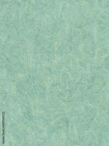 Handmade sheet in shades of green. Kraft paper with bio mass with small plants and petals. Seamless background best for eco projects. 