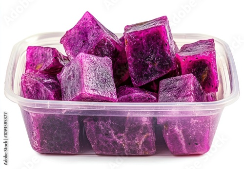 A container filled with vibrant purple ice cubes, likely made from a fruit or beverage.