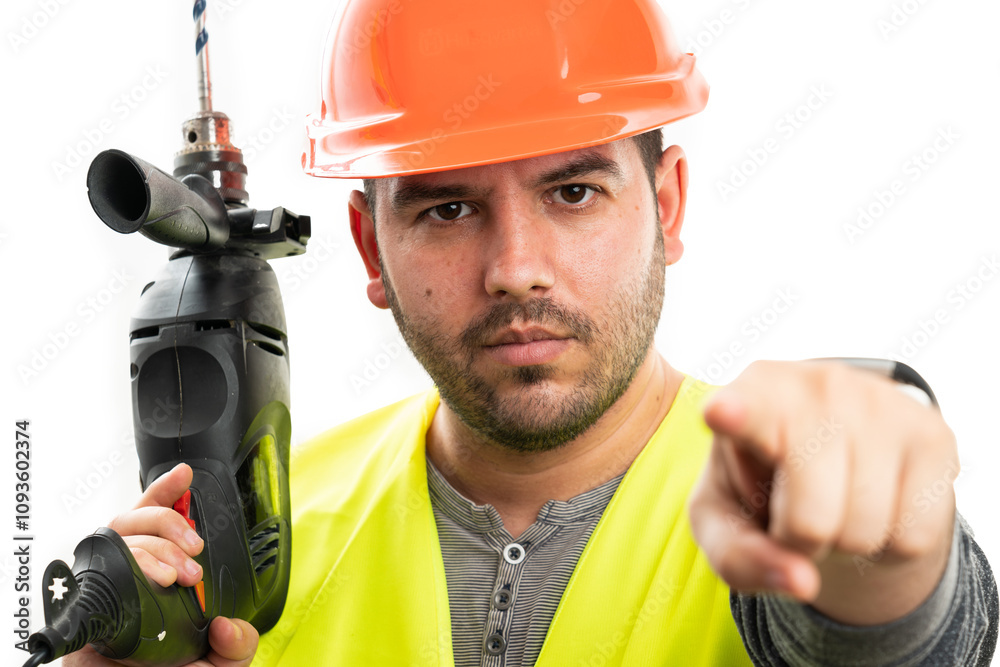 Close-up of serious workman pointing index finger holding drill Close-up of serious workman pointing index finger holding drill