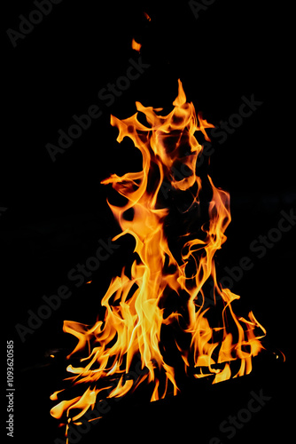 bright fiery dancing flame on black background
