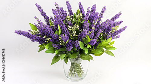 A vibrant bouquet of fresh lavender flowers and green leaves in a clear glass vase on a white background