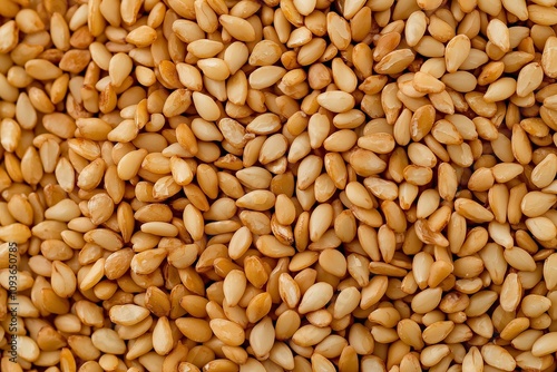 A Close-Up View of Toasted Sesame Seeds, Emphasizing Their Warm Tones and Texture. Suitable for Food-Themed Designs, Cooking Content, or Spice Photography.