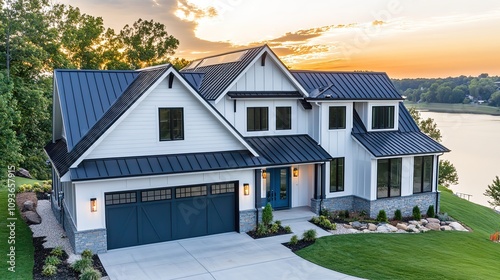 Fototapeta Naklejka Na Ścianę i Meble -  Modern farmhouse with lake view at sunset.