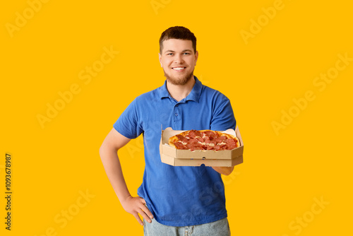 Happy young man holding car...
