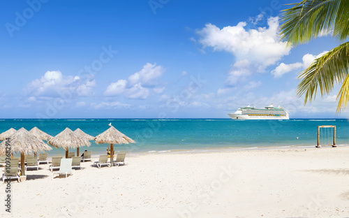 View from tropical beach on cruise ship sailing from port 