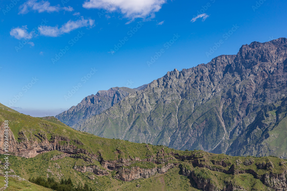 Caucasian mountains near Gergeti village, Stepansminda. Kazbegi mountain behind the clouds. Georgia